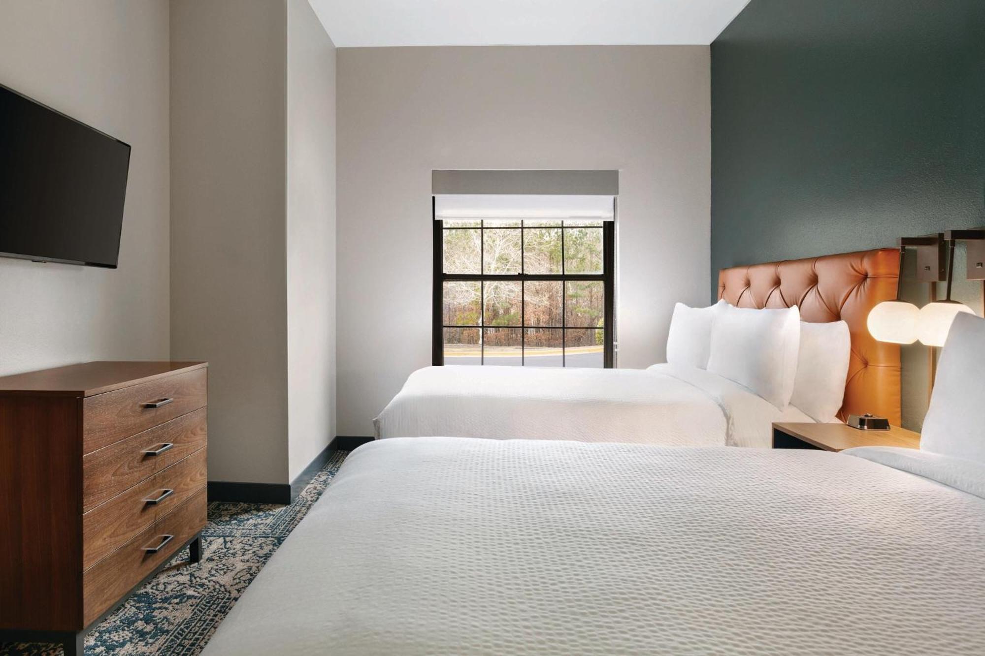 Two-Bedroom Suite with Four Queen Beds and Sofa Bed